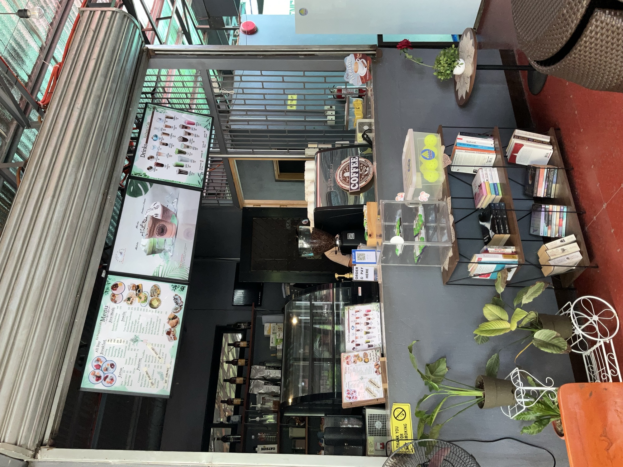 The service counter with the menu boards above it