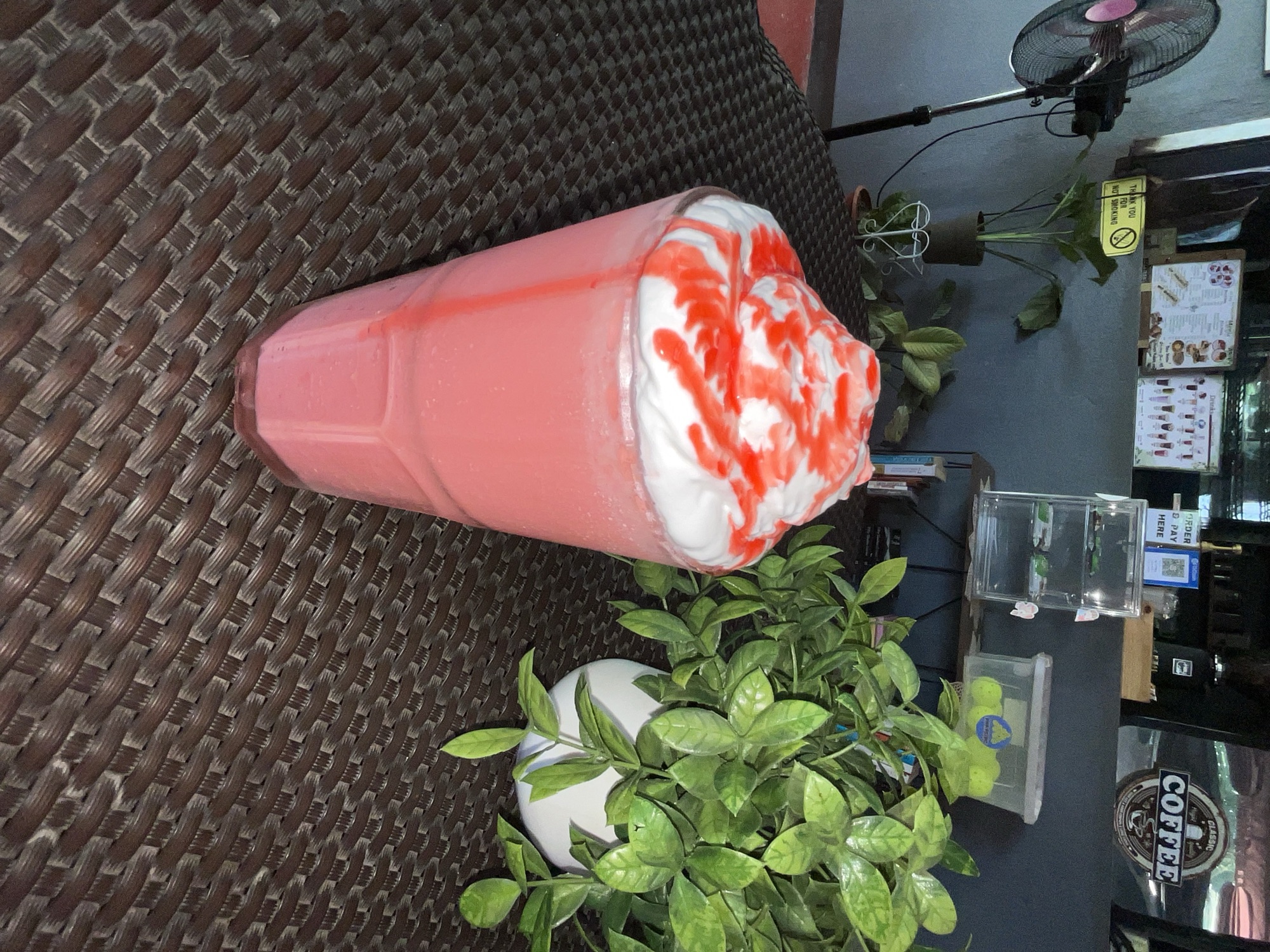 Strawberry frappe topped with cream and syrup