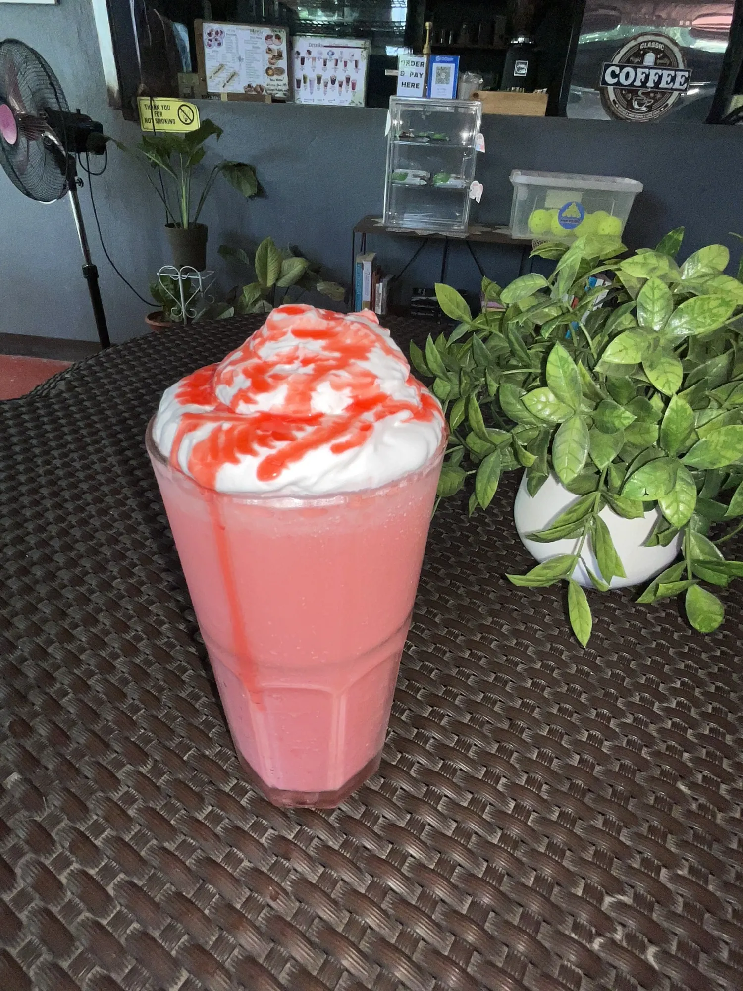 Strawberry frappe topped with cream and syrup