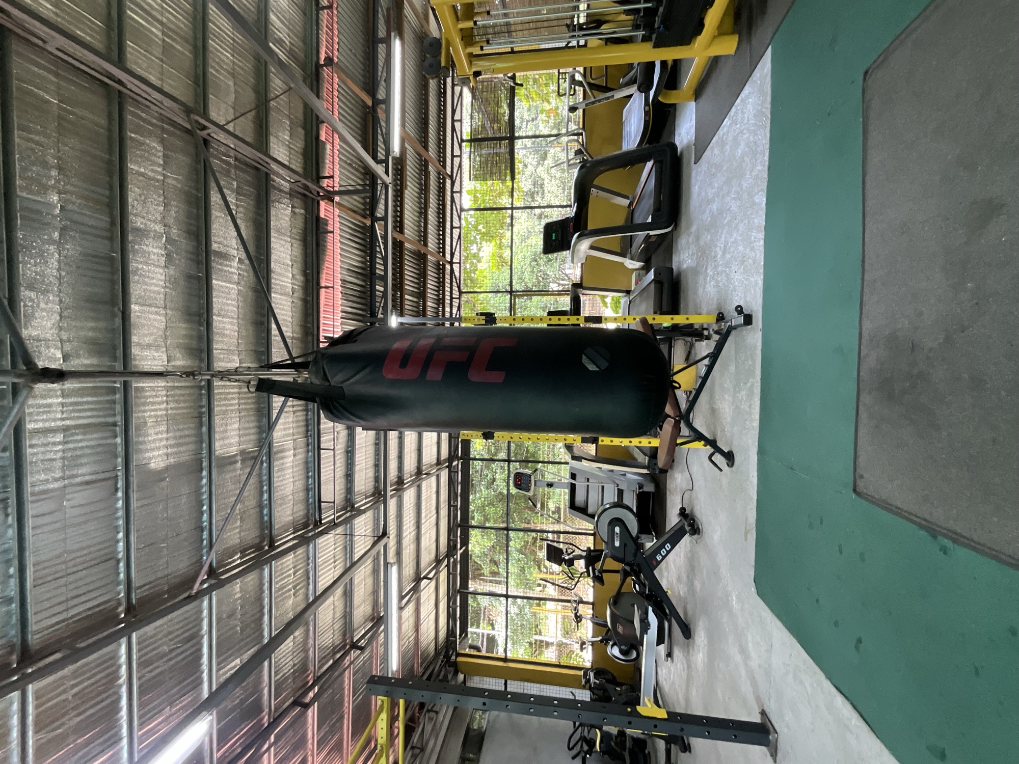 Heavy bag hanging at the open edge of the gym