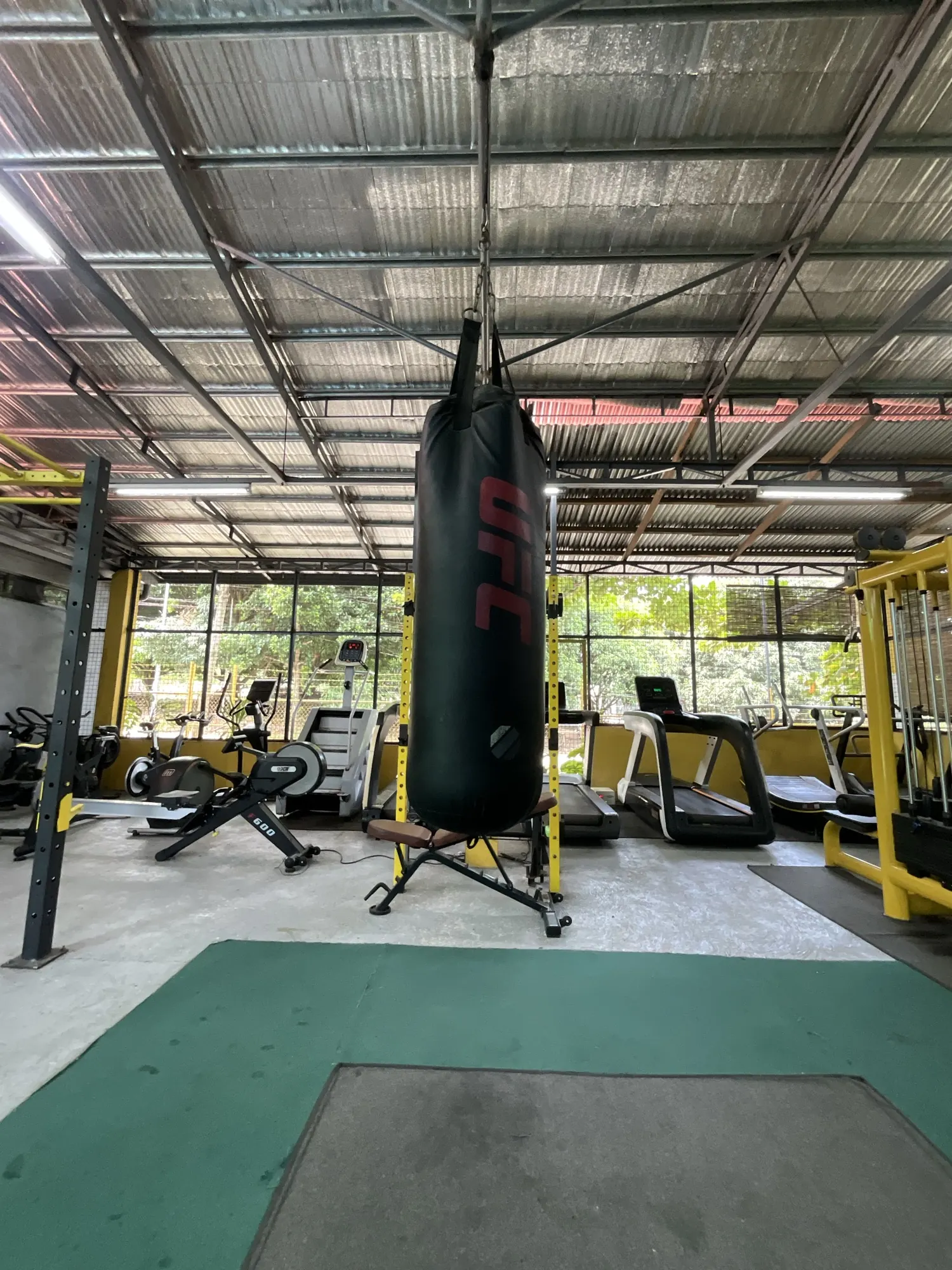 Heavy bag hanging at the open edge of the gym