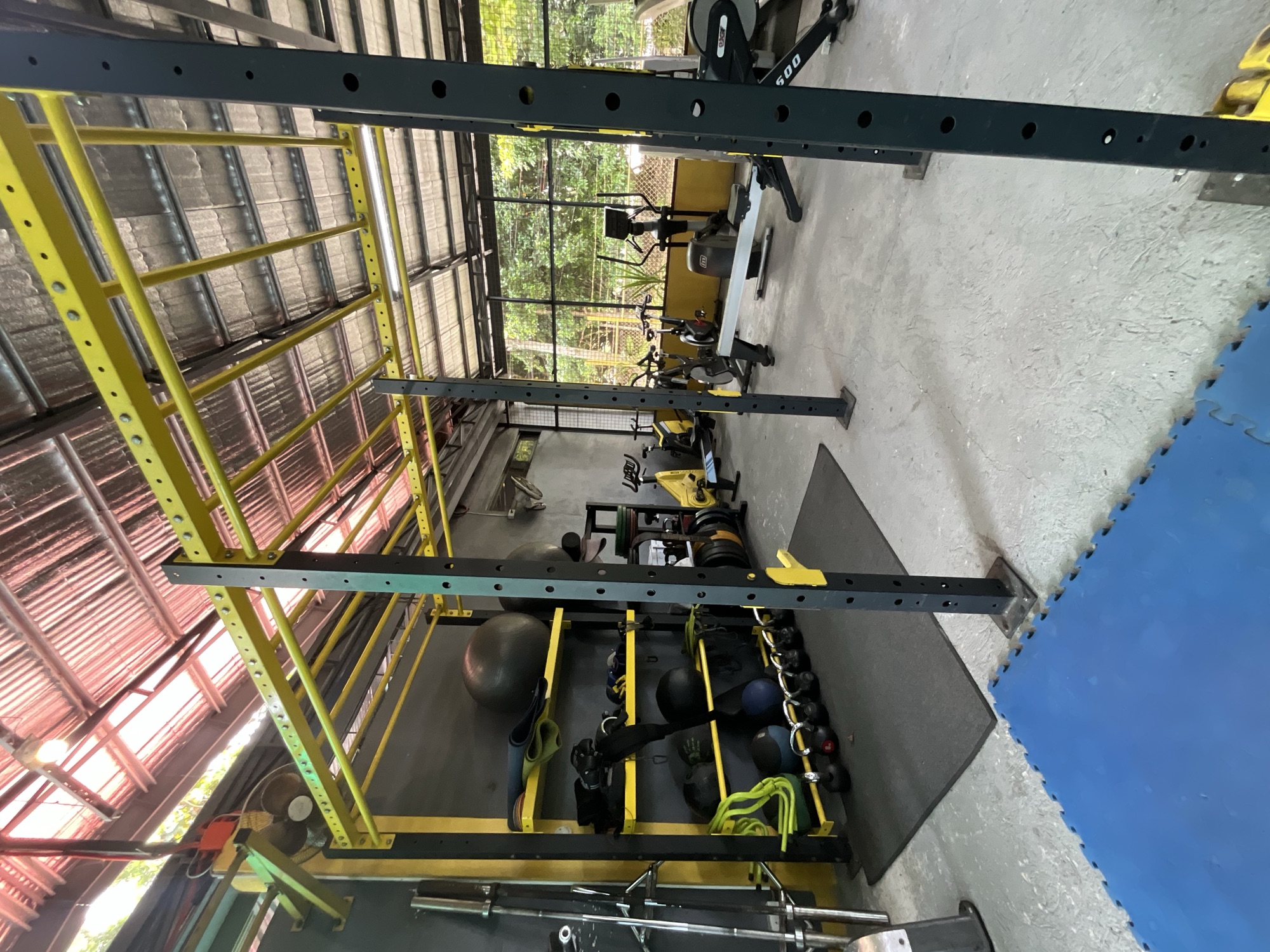 Functional training rig with kettlebells and medicine balls